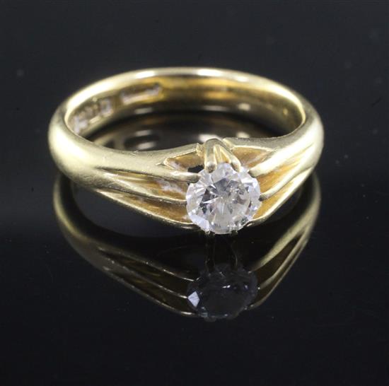 A 1930s 18ct gold and claw set solitaire diamond ring, size U.